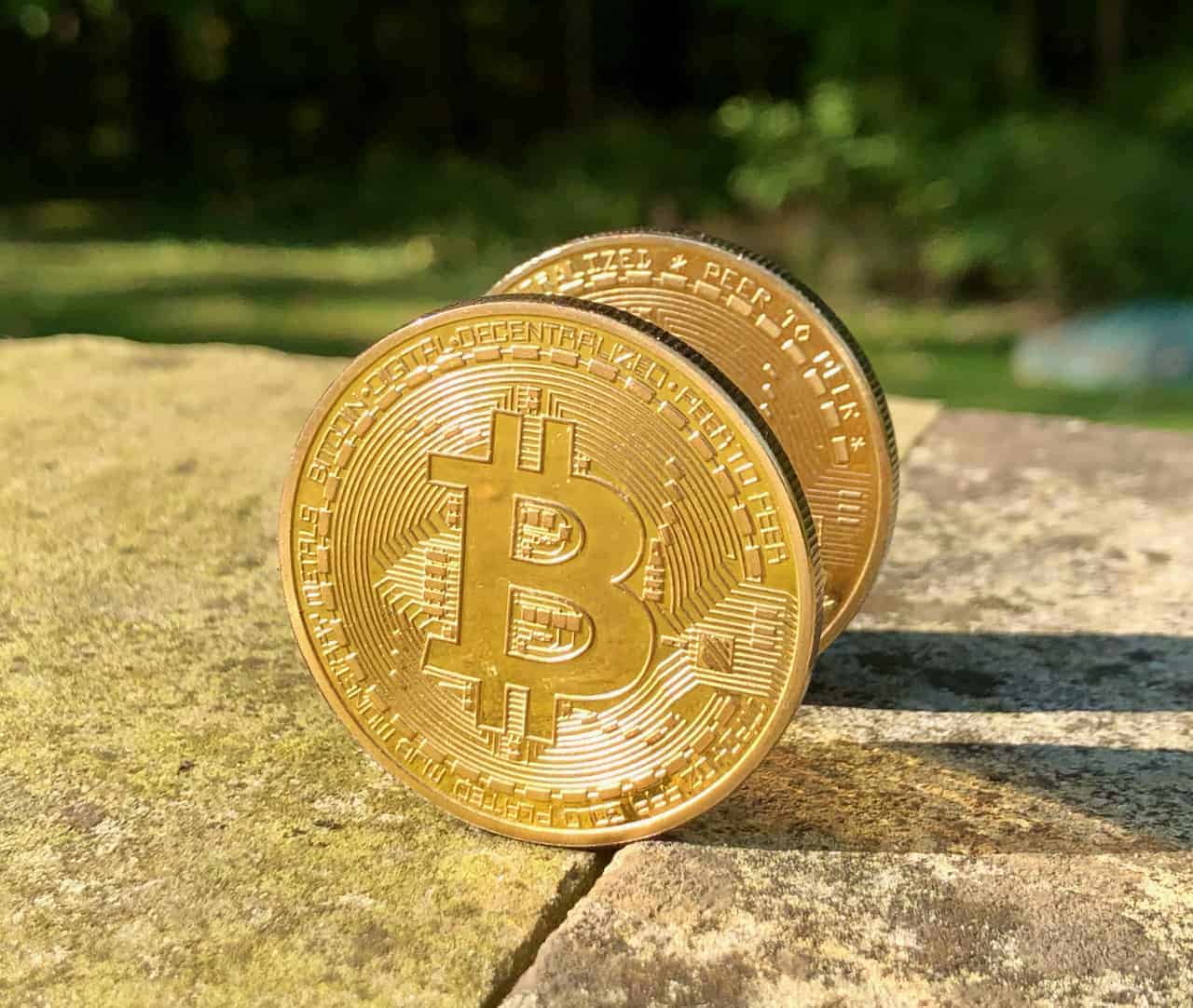 A graphic representing a digital currency with a large 'M' symbol superimposed, symbolizing MicroStrategy's influence on Bitcoin.