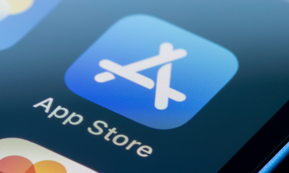 Illustration of a digital shield protecting an app store icon from incoming malicious data streams.