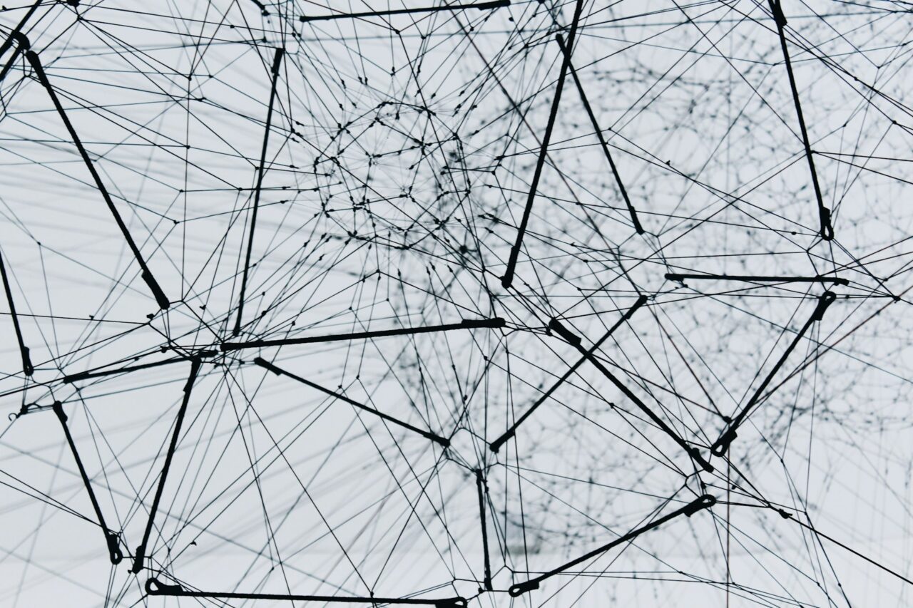 A graphic illustration of interconnected financial data streams symbolizing a partnership.