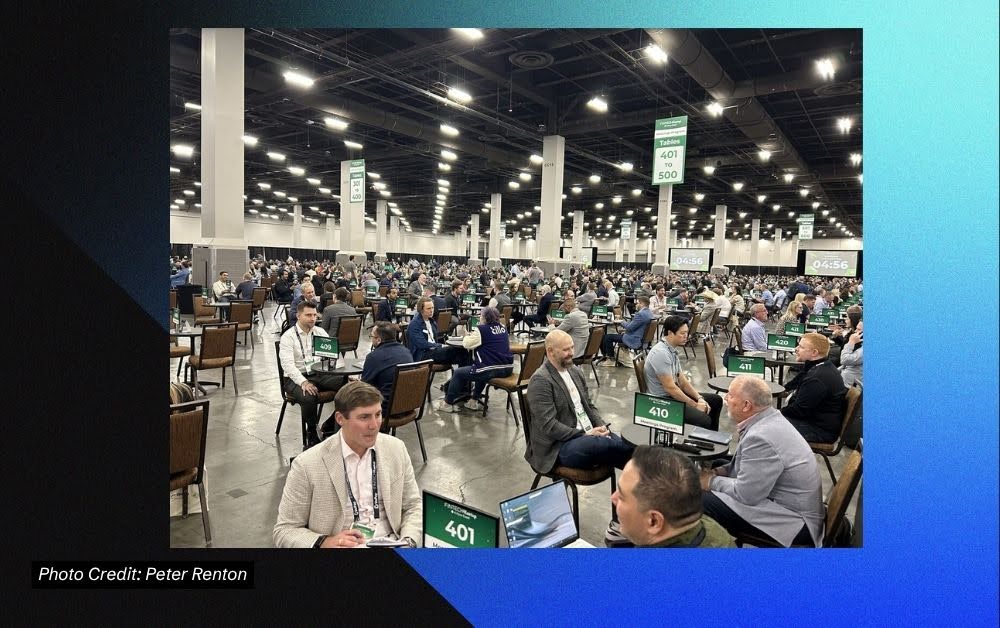 Crowded expo floor at Fintech Meetup 2026 with cash flow underwriting booths and skeptical attendees