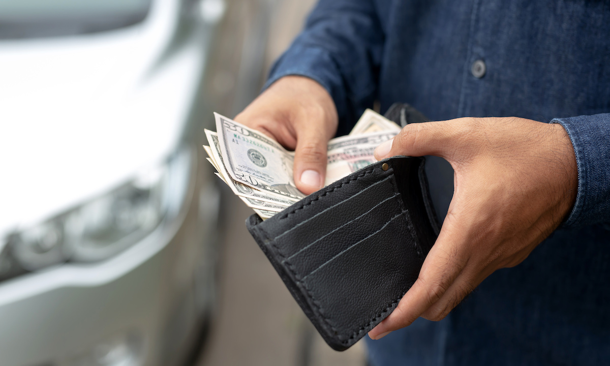 Workers waiting for paychecks; clock and dollar sign imagery representing the tension between time and money access