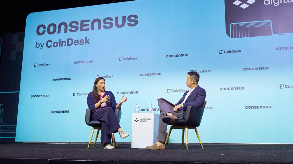 Lily Liu speaking at a conference stage