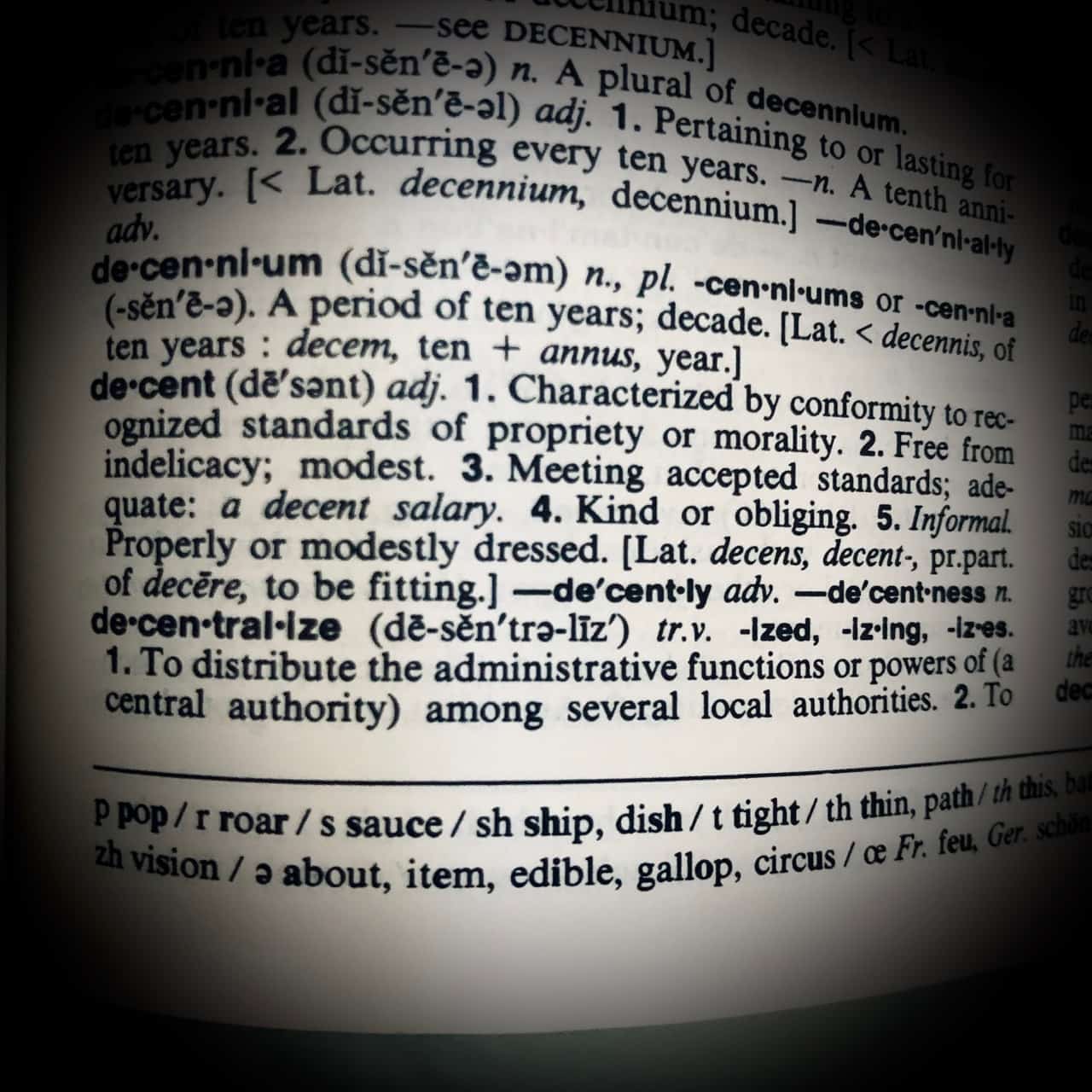A hand holding a digital currency coin with a circuit board pattern overlay, symbolizing the intersection of finance and technology.