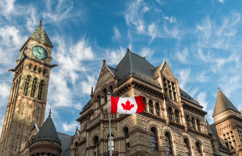 A graphic representing a digital Canadian dollar coin on a blockchain network.
