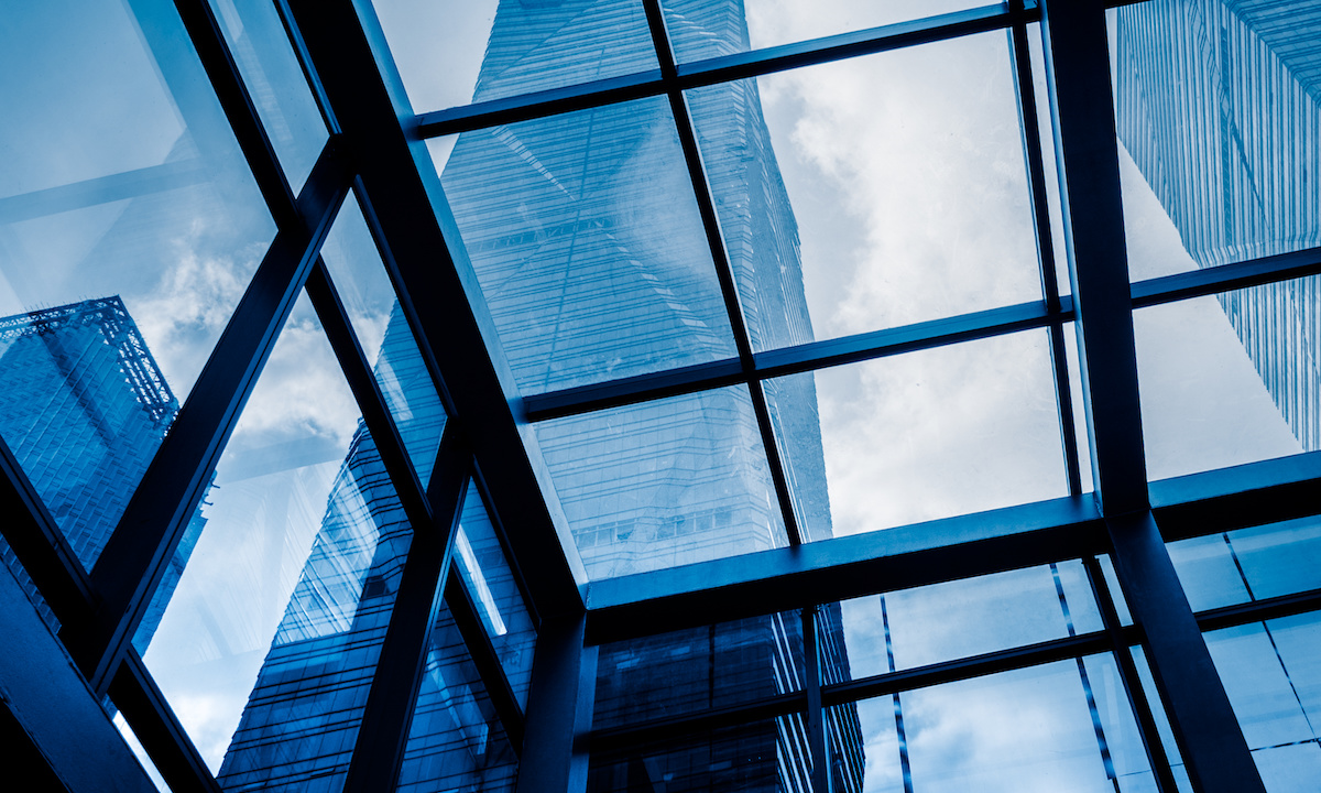 Illustration of a soaring skyscraper with a cracked glass ceiling