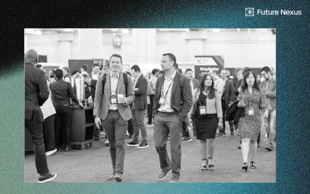 Crowded fintech conference lobby with deal-making conversations in Vegas