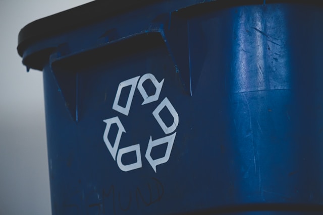 Illustration of a digital recycle bin overflowing with financial data symbols.