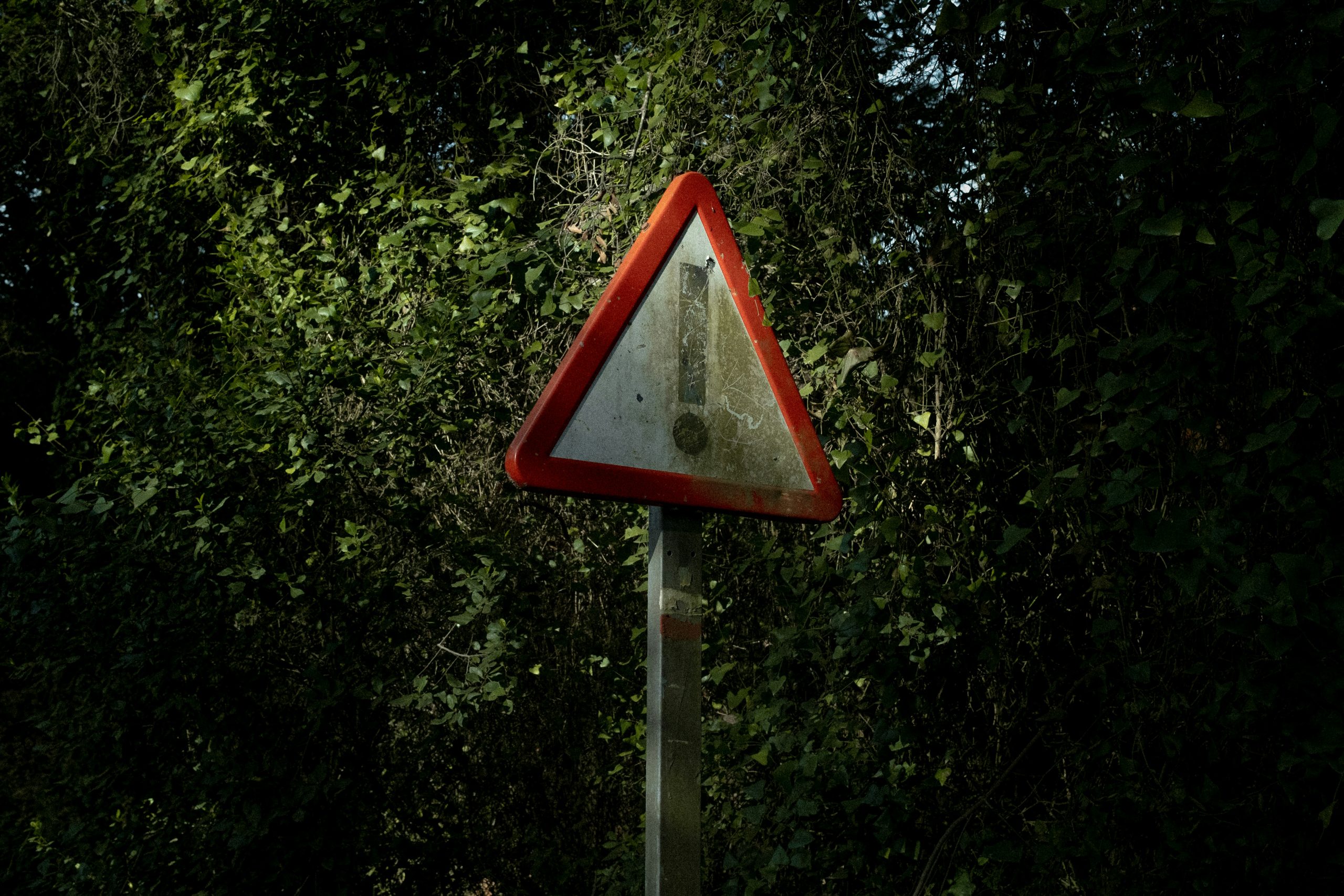 Cracked digital ID screen with global map overlay and regulatory deadlines ticking