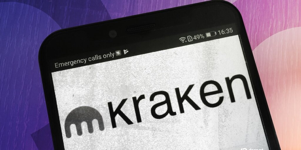 Kraken logo with a Dubai skyline background