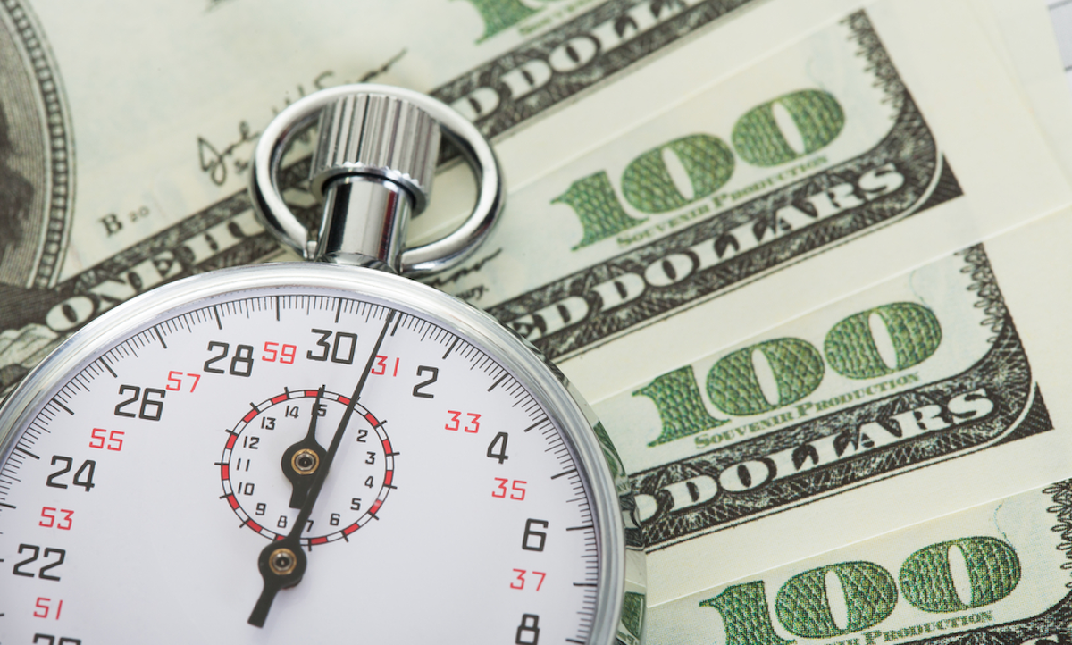 A stylized graphic representing a financial transaction with speed lines and dollar signs.